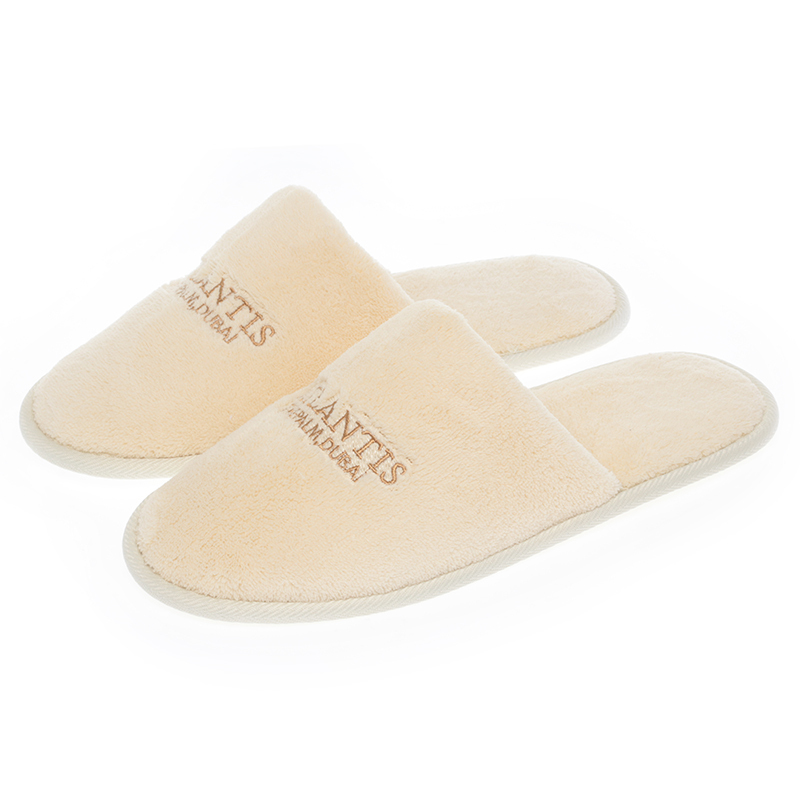 What are the common materials for hotel slippers?