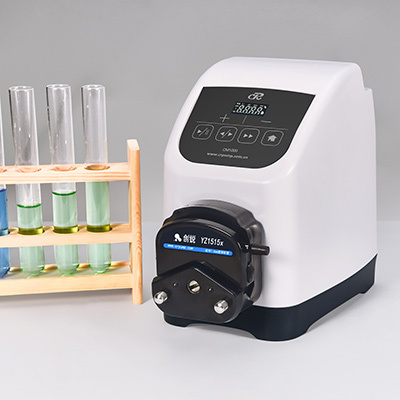 Why are peristaltic pumps used in extraction experiments?