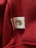 The hoodie looks very good, the quality is very good. The Bape bag, the Bape tag, the bullseye sign, the stitching, the shark face, the WGM (World Gone Mad) is stitched on good, the Bape 'ape' on the wrist sleeve has a perfect color tone even the lower Bape tag is in the perfect gold glitter tone because the older Bape hoodies also had the gold glitter tone on the lower tag so this is the older version of the red shark face hoodie which is good. Even the red Color is right and the wrist sleeves also have a perfect red color. The only negative aspect that I saw was the M on the WGM that’s stitched on the M was a little bit squished together so that you couldn’t see the purple line in the middle, but that is the only thing that I noticed negatively even though that is something that you can´t really see when you are wearing it normally. I would also consider sizing up if you want a more baggy look and if you want to zip up your hoodie completely to the top. Overall the hoodie is very good and PkStockX is a very customer friendly company and I can only recommend them, their work is just good. I will also buy again from here in the future. Thank you so much PkStockX.