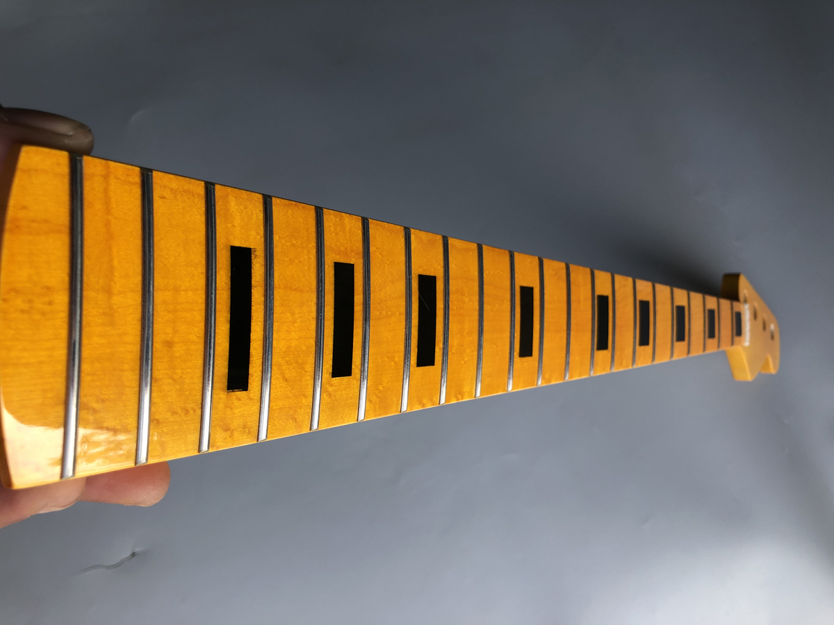 electric violin, electric cello, electric guitar, violin bow, violin case, guitar neck, guitar body