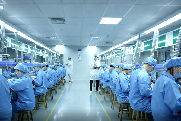 Workers are manufacturing empty e-cigarette devices in the factory
