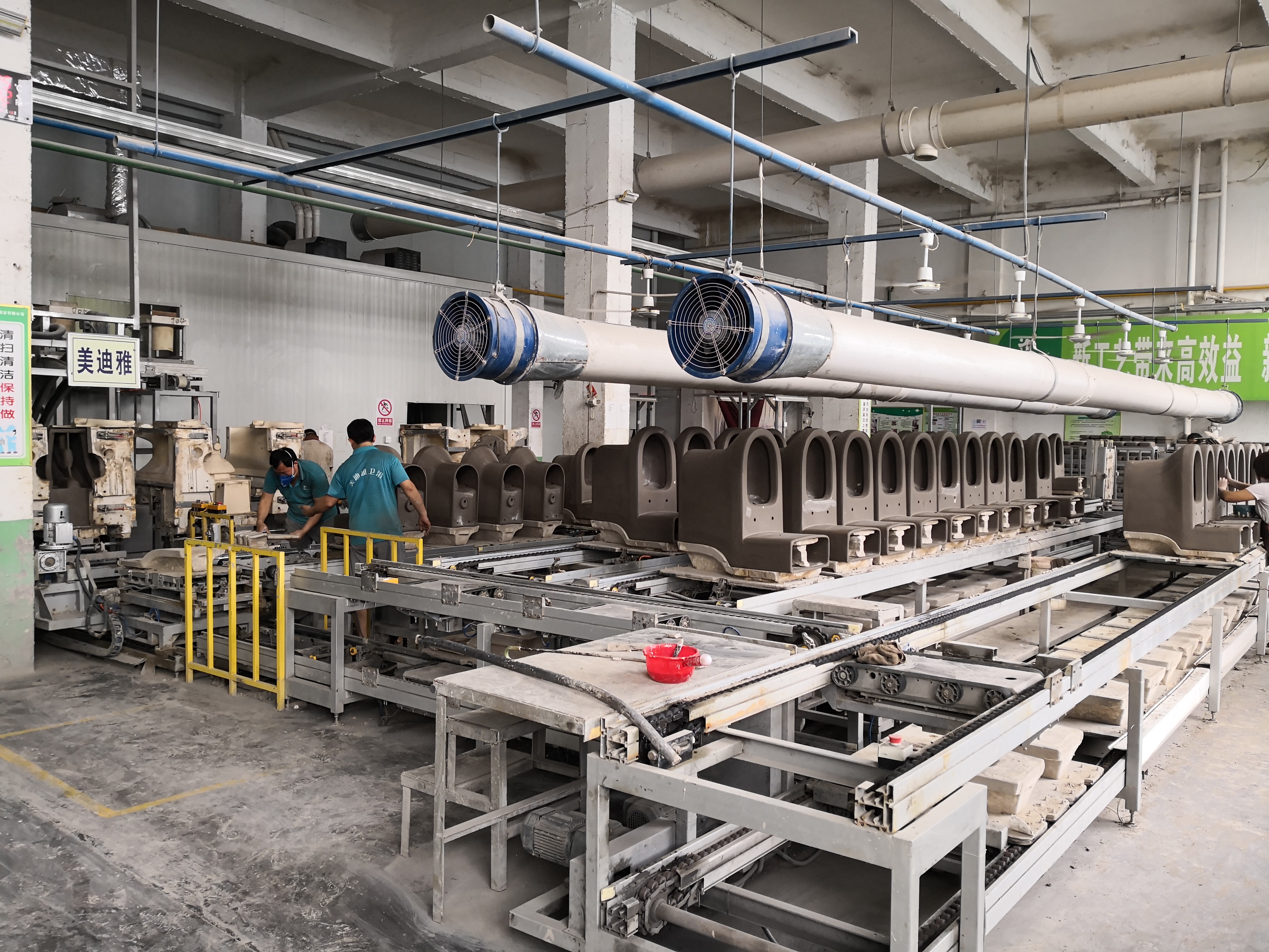 Ceramic casting unit demonstrating the production of one-piece toilets