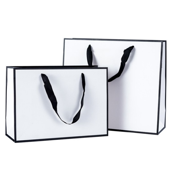 Elegant White Paper Bags with Black Handles for Retail & Branding 