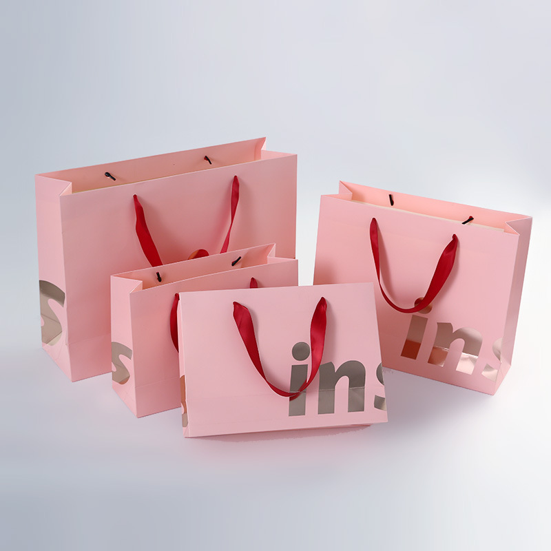 Wholesale Recyclable Pink Paper Shopping Bags with Printed Logo 