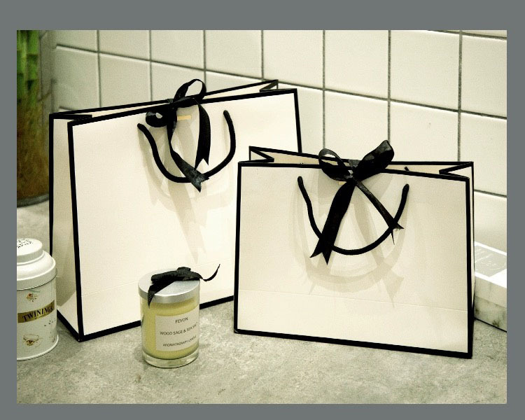 Elegant White Paper Bags with Black Handles for Retail & Branding 