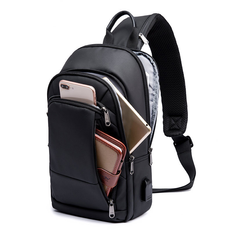 OutdoorMaster Sling Bag - Crossbody Backpack for Women & Men With USB Charging Port
