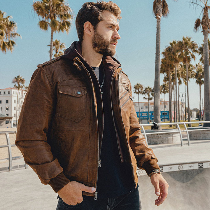 Leather moto jacket with removable hood outlet